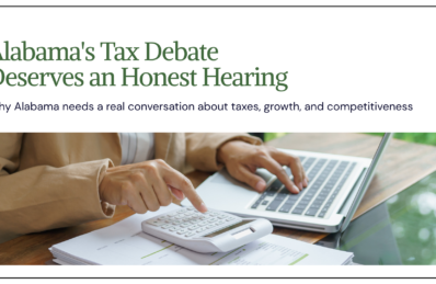 Alabama's Tax Debate Deserves an Honest Hearing. Person using a calculator and laptop with financial documents.